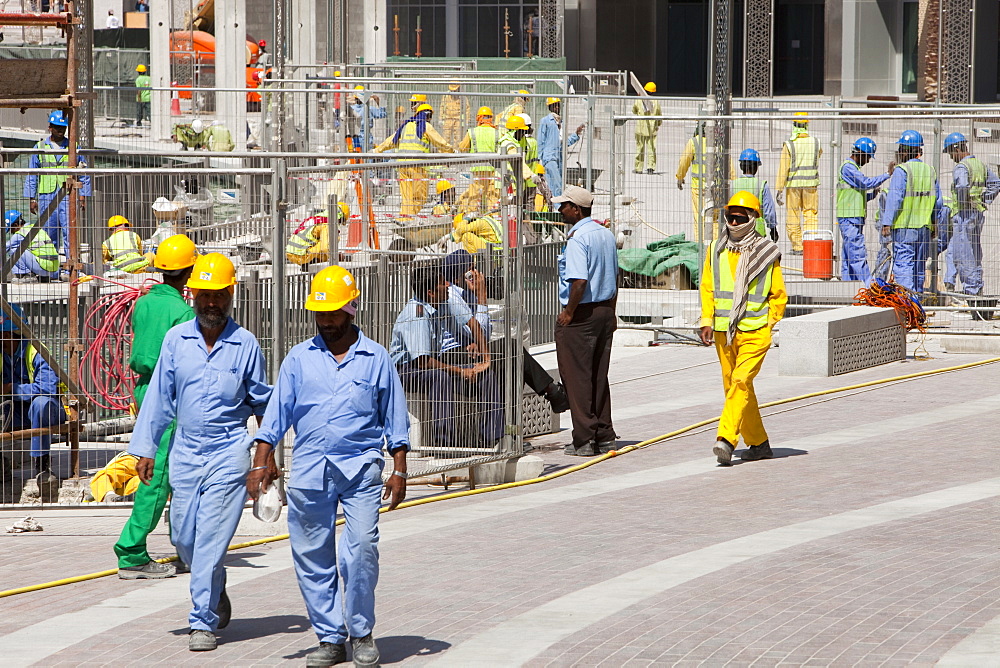 Construction workers working near the Burj Dubai in Dubai, United Arab Emirates, Middle East