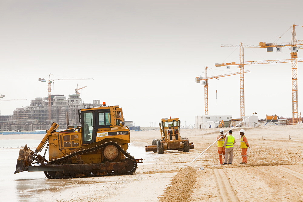 Workers creating a new beach resort on the Palm development in Dubai, United Arab Emirates, Middle East