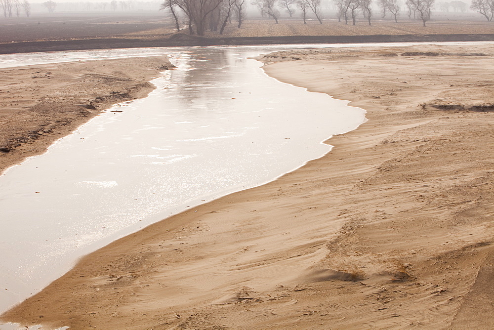 A river at a low level due to over-extraction, drought and climate change, just north of Beijing in Heilongjiang province, China, Asia