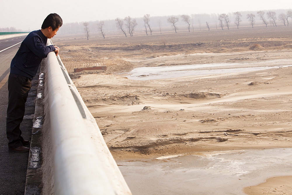 A river at a low level due to over-extraction, drought and climate change, just north of Beijing in Heilongjiang province, China, Asia