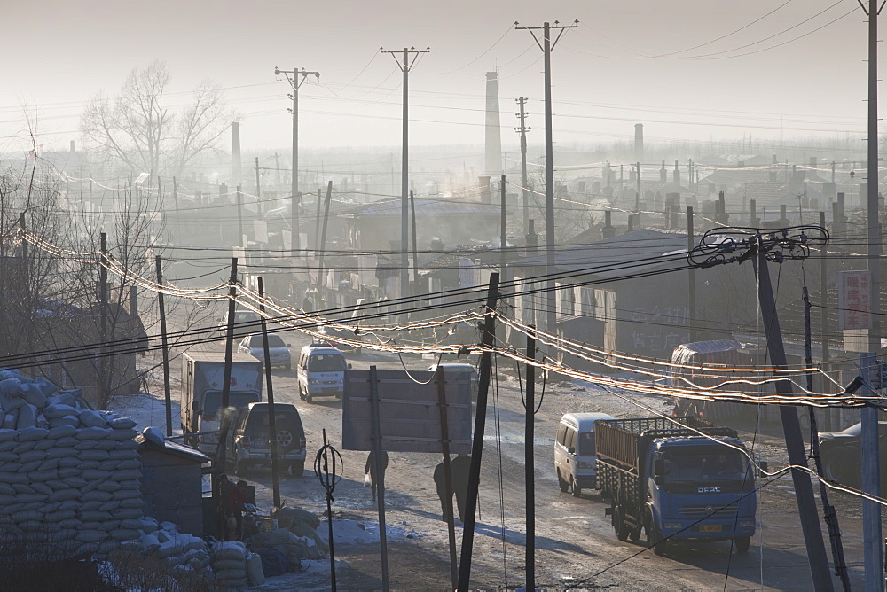 Slum dwellings in Suihua, Heilongjiang Province pump out coal smoke into an already highly polluted atmosphere, China, Asia