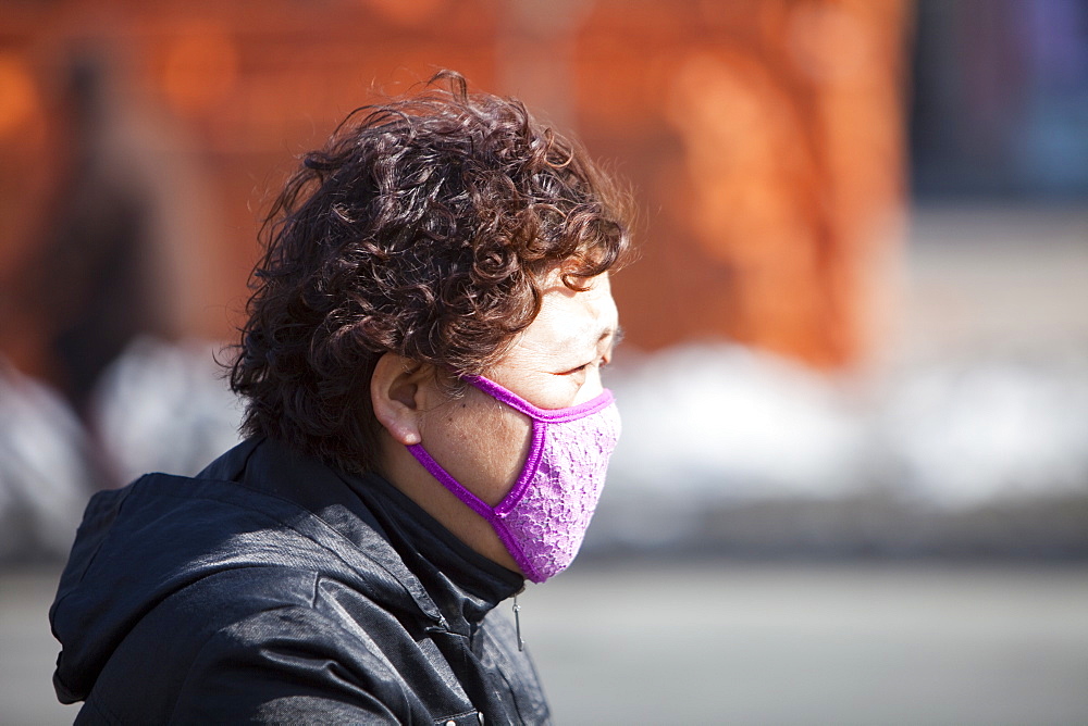 People wear face masks against the awful air pollution in Suihua city in Northern China, Asia