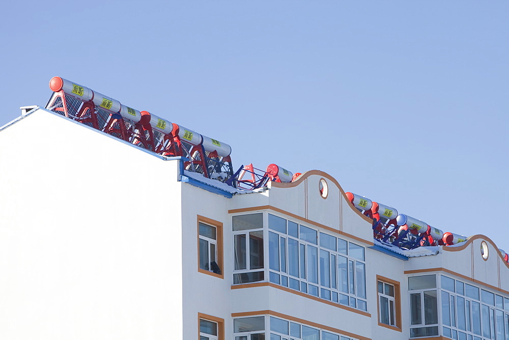 Solar water heaters on roofs of housing complex in Heilongjiang province, Northern China, Asia