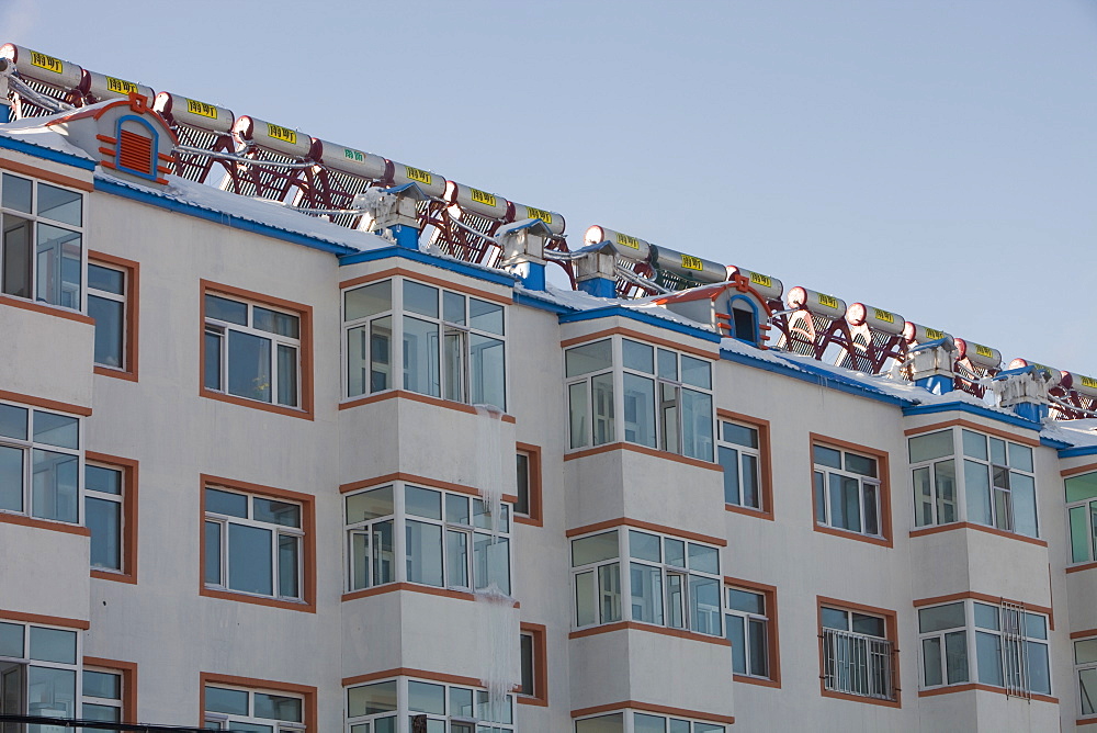 Solar water heaters on roofs of housing complex in Heilongjiang province, Northern China, Asia