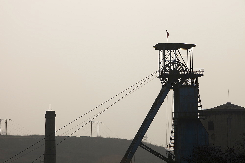 Highly polluted smog hangs over the pit head of a coal mine near Tongshuan in Shanxi province, China, Asia