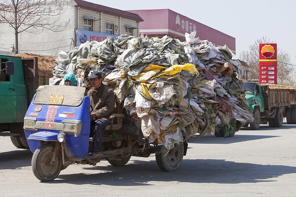 A truck laden with plastic heading for a recycling plant near Xian city, Northern China, Asia