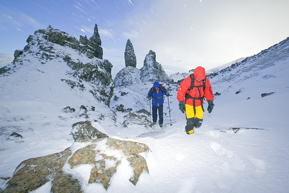 Hikers in a blizzard near the Old Man of Storr on the Isle of Skye, Scotland, United Kingdom, Europe