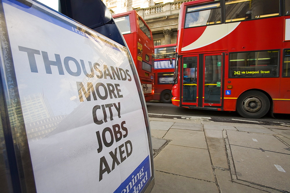 Newspaper hoarding announcing more job losses in the 2008 credit crunch, in front of The Bank of England, City of London, London, England, United Kingdom, Europe