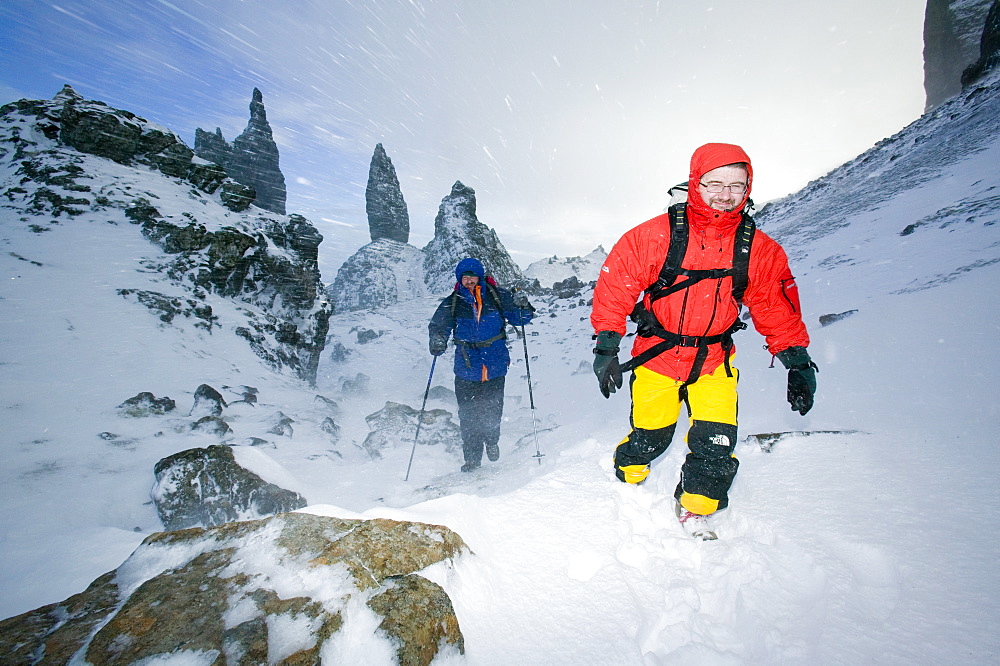 Hikers in a blizzard near the Old Man of Storr on the Isle of Skye, Scotland, United Kingdom, Europe