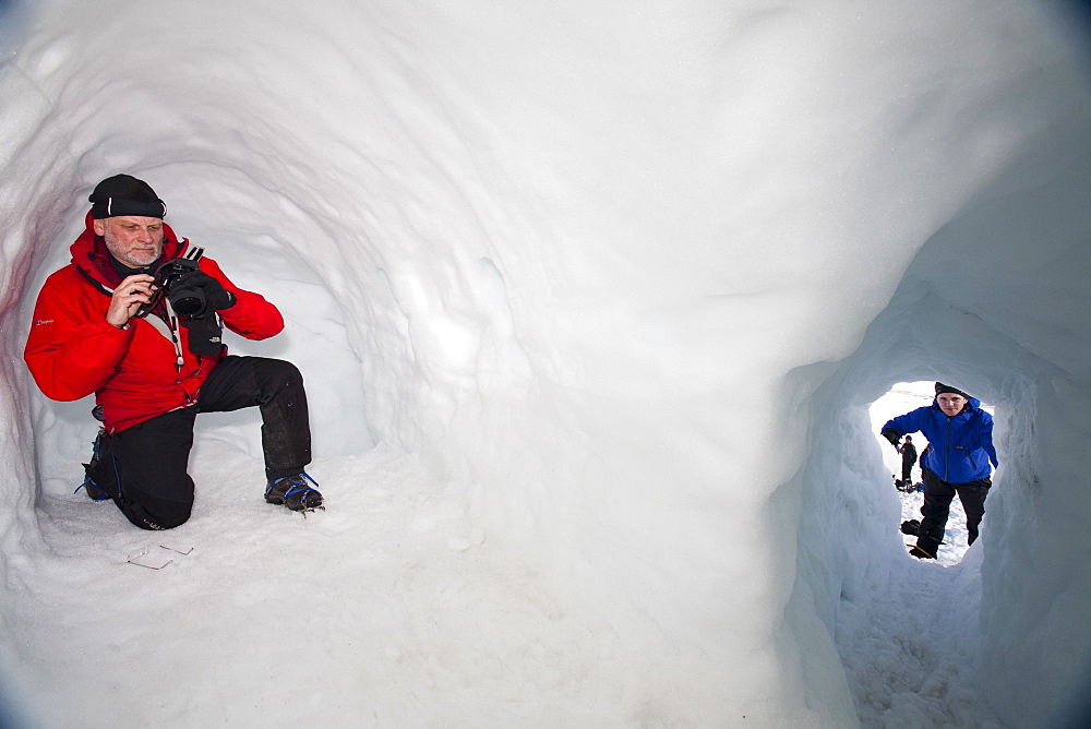 A group of mountaineers building snow holes on Cairngorm in the Cairngorm National Park in Scotland, United Kingdom, Europe