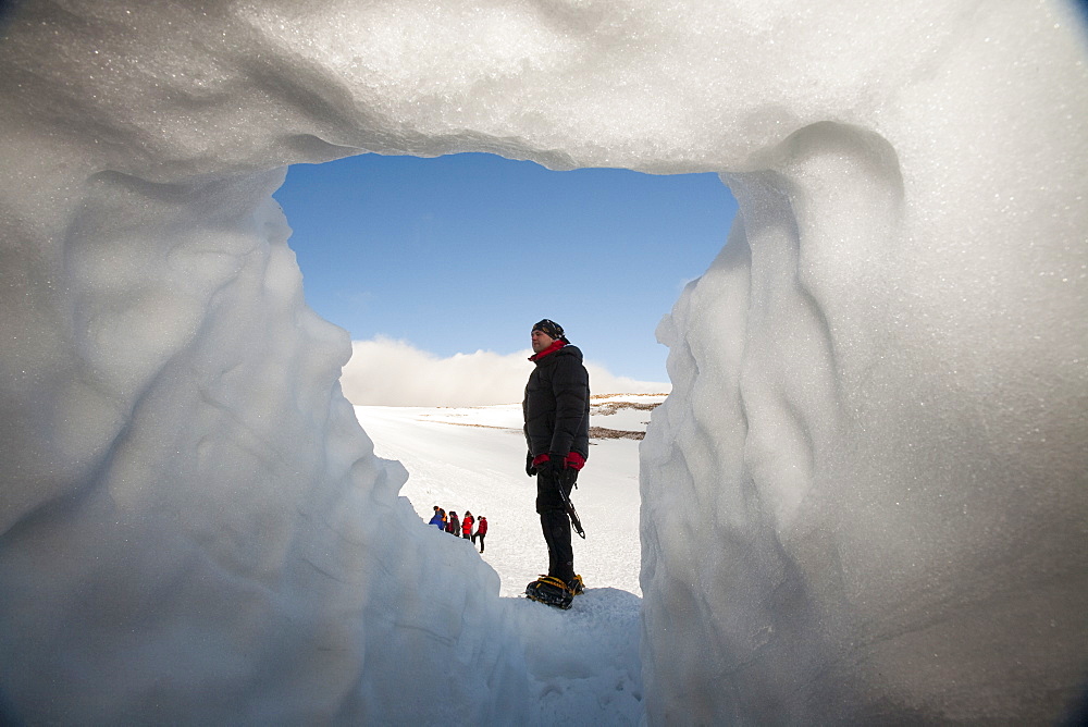 A group of mountaineers building snow holes on Cairngorm in the Cairngorm National Park in Scotland, United Kingdom, Europe