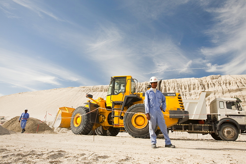 Arab workers working on a reclamation scheme to build another exclusive hotel resort on what was formerly seabed in Dubai, United Arab Emirates, Middle East