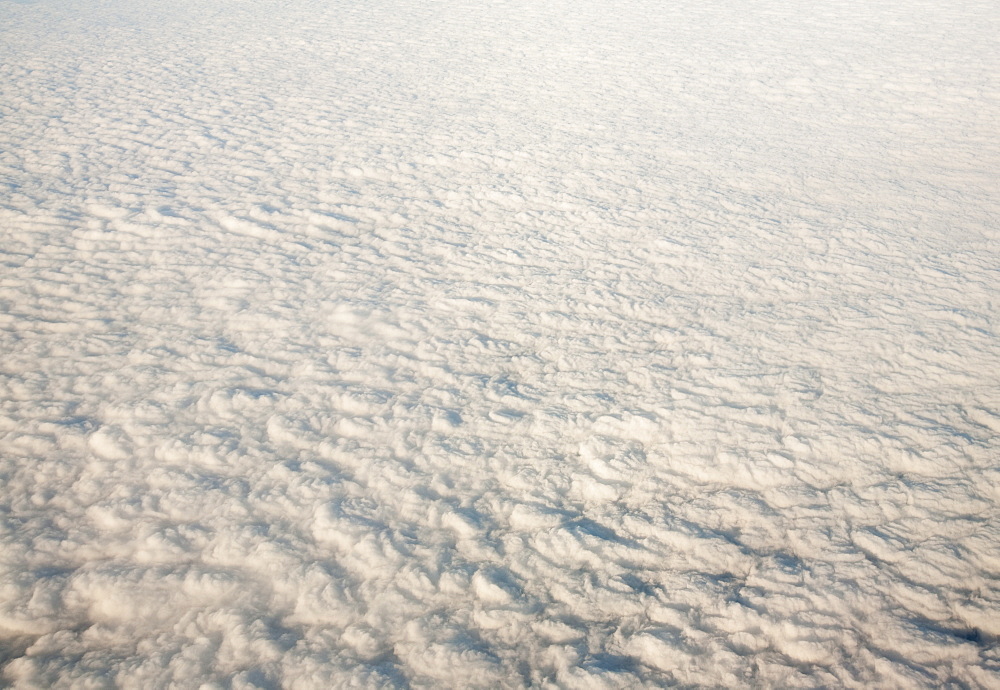 Flying over a bank of low cloud across Iran, Middle East