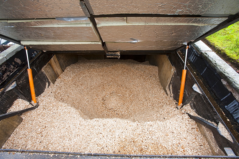 The woodchip hopper for a biofuel boiler in the grounds of the Langdale Timeshare in the Lake District, Cumbria, England, United Kingdom, Europe