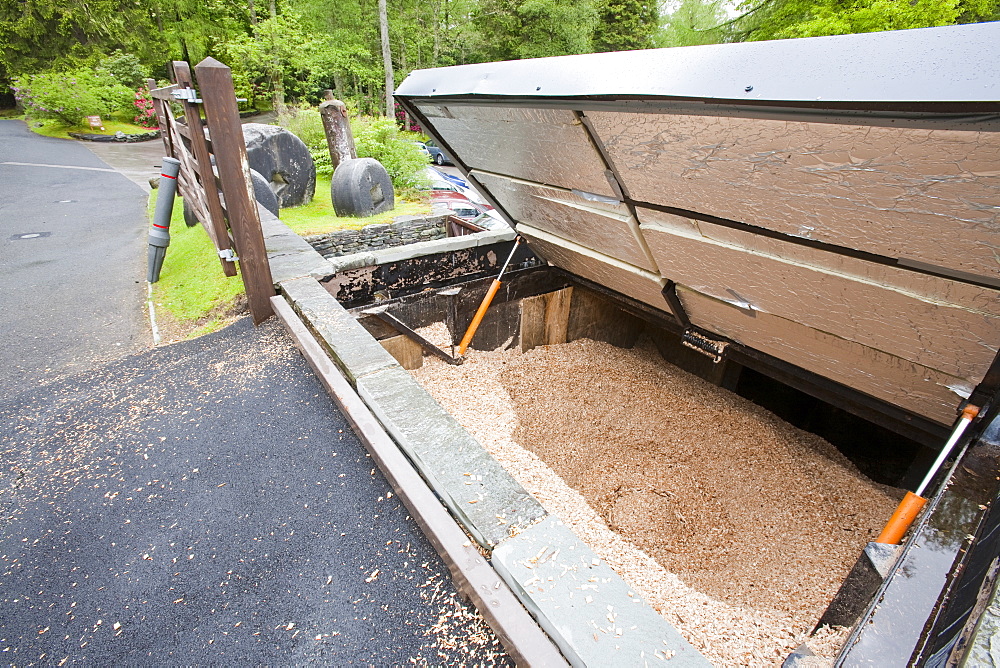 The woodchip hopper for a biofuel boiler in the grounds of the Langdale Timeshare in the Lake District, Cumbria, England, United Kingdom, Europe