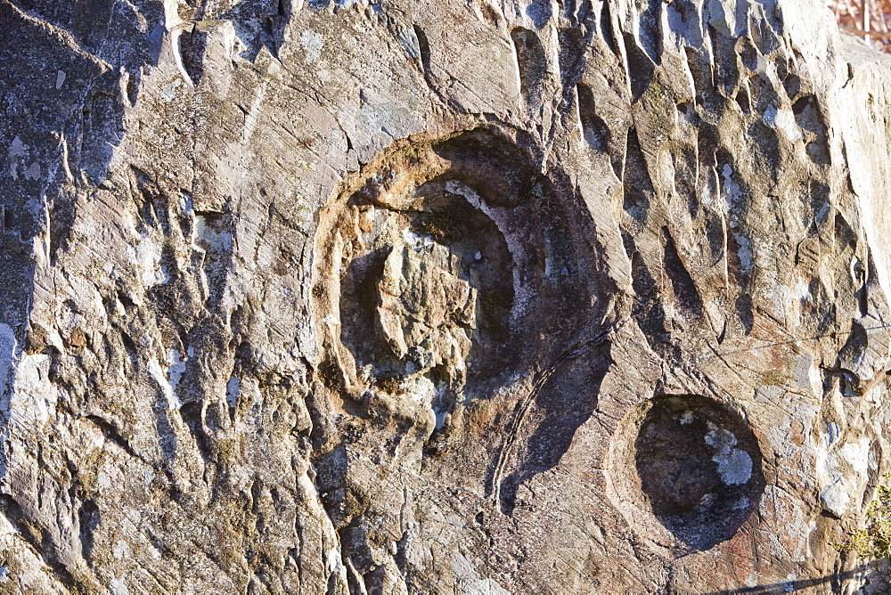 Inclusion marks on a boulder above the Langdale Valley in the Lake District, Cumbria, England, United Kingdom, Europe