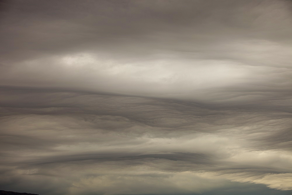 Patterns in cloud on an occluded front over the Lake District hills in Ambleside, Cumbria, England, United Kingdom, Europe