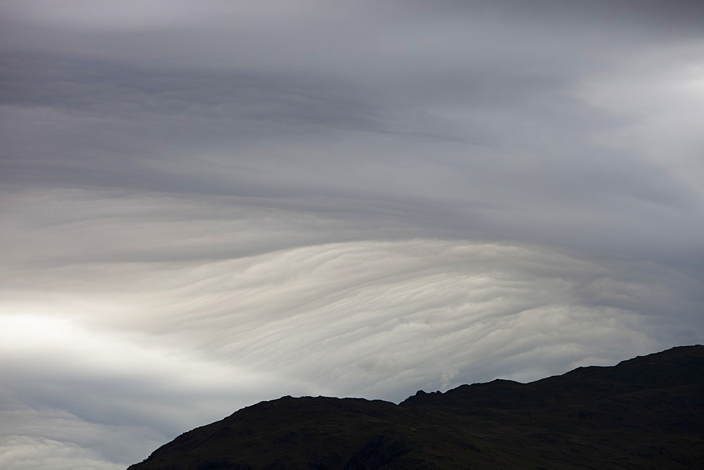 Patterns in cloud on an occluded front over the Lake District hills in Ambleside, Cumbria, England, United Kingdom, Europe