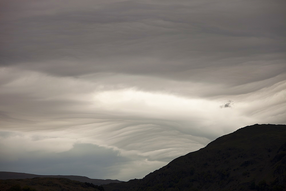 Patterns in cloud on an occluded front over the Lake District hills in Ambleside, Cumbria, England, United Kingdom, Europe