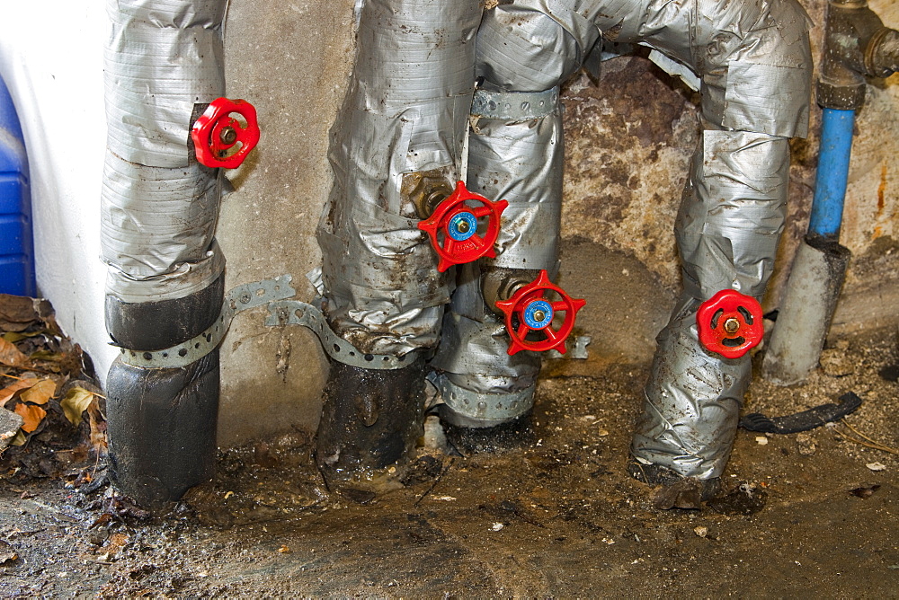 Pipes coming up from 55 metres down for a ground source heat pump, in a house in Ambleside, Cumbria, England, United Kingdom, Europe