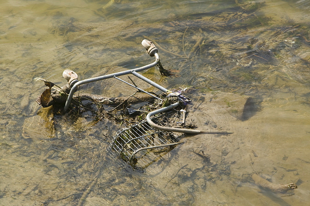 Supermarket trolley thrown into the River Taw in Barnstaple Devon, England, United Kingdom, Europe