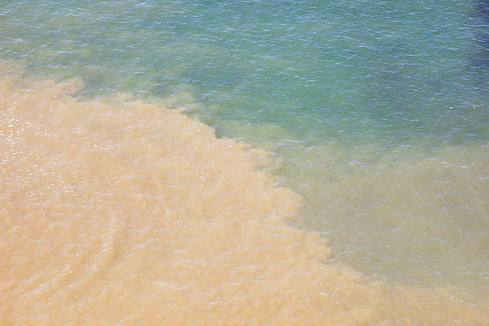 Murky river water mixing with clear sea water at Ilfracombe on the North Devon Coast, Devon, England, United Kingdom, Europe