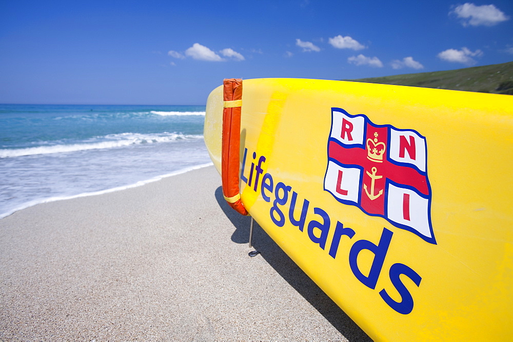 A lifeguard's surf board on the beach at Nanven Cove in Cornwall, England, United Kingdom, Europe