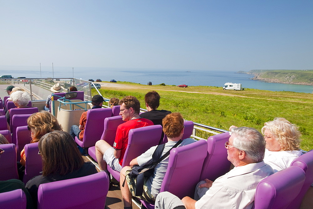 Tourists on an open topped bus at Lands End in cornwall,, United Kingdom