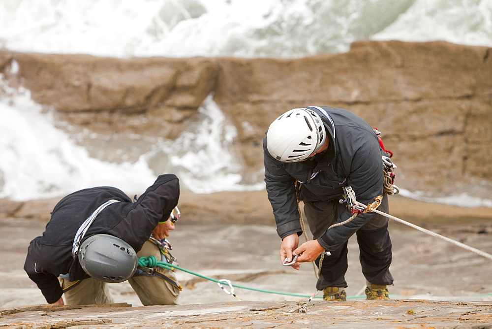 Climbers on a sea cliff climb on Baggy Point near Croyde in north Devon, England, United Kingdom, Europe