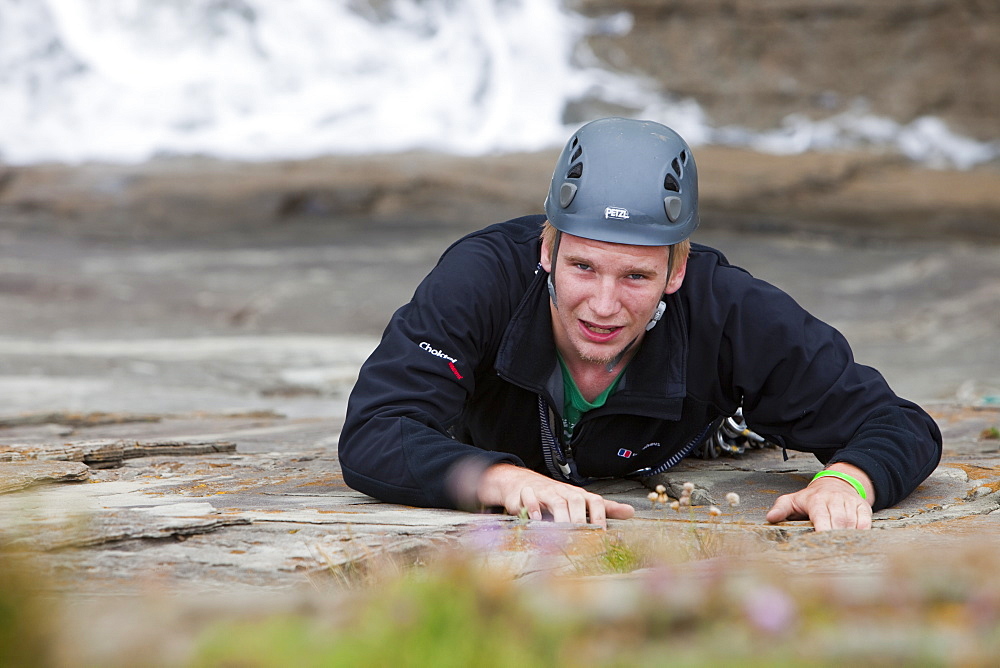 Climber on a sea cliff climb on Baggy Point near Croyde in north Devon, England, United Kingdom, Europe