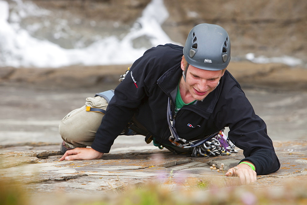 Climber on a sea cliff climb on Baggy Point near Croyde in north Devon, England, United Kingdom, Europe