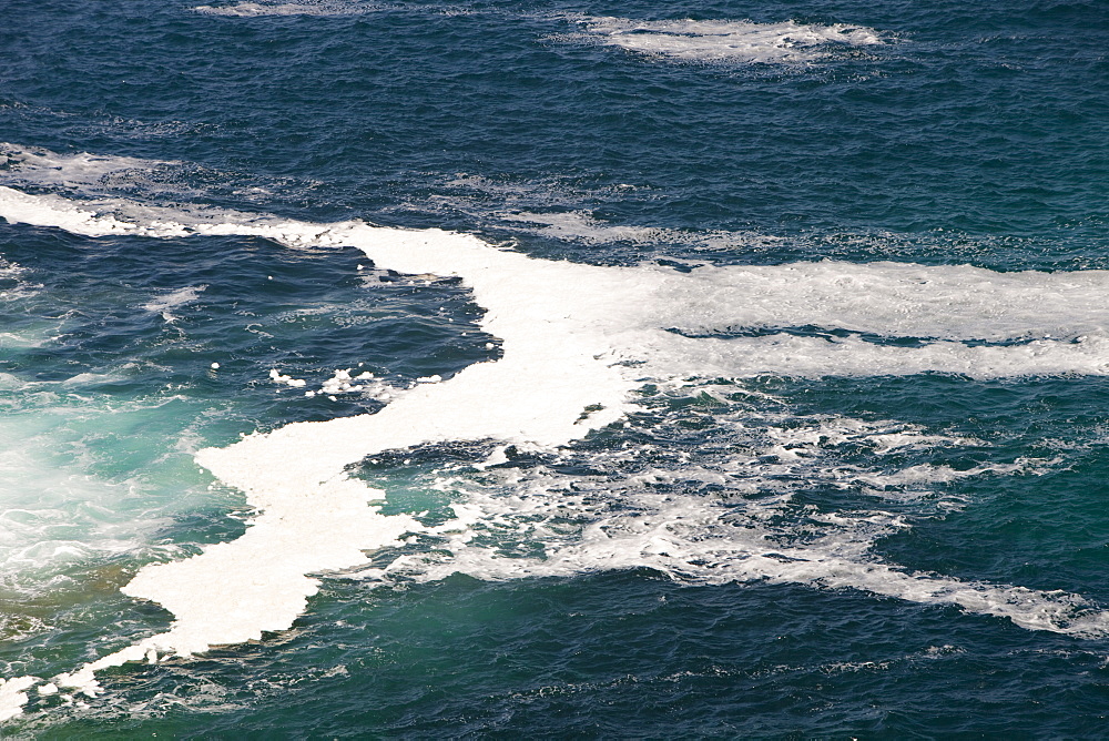 Spume on the coast near St. Just, Cornwall, England, United Kingdom, Europe