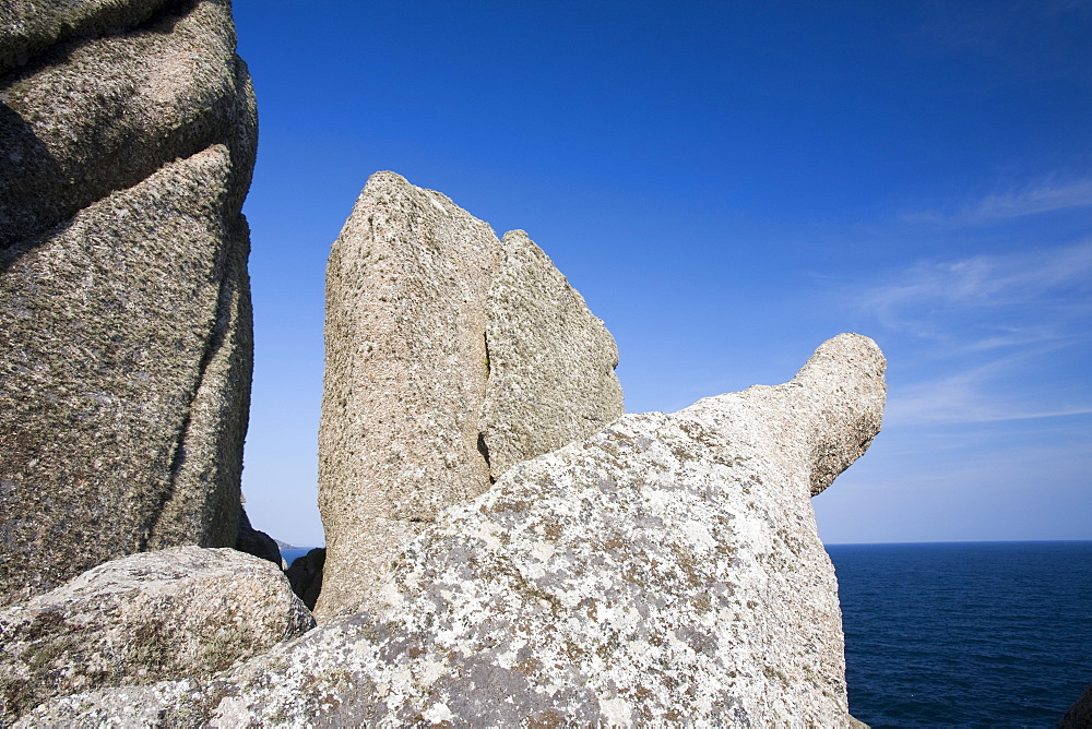 Granite sea cliffs at Logan Rock Headland in Porthcurno, Cornwall, England, United Kingdom, Europe