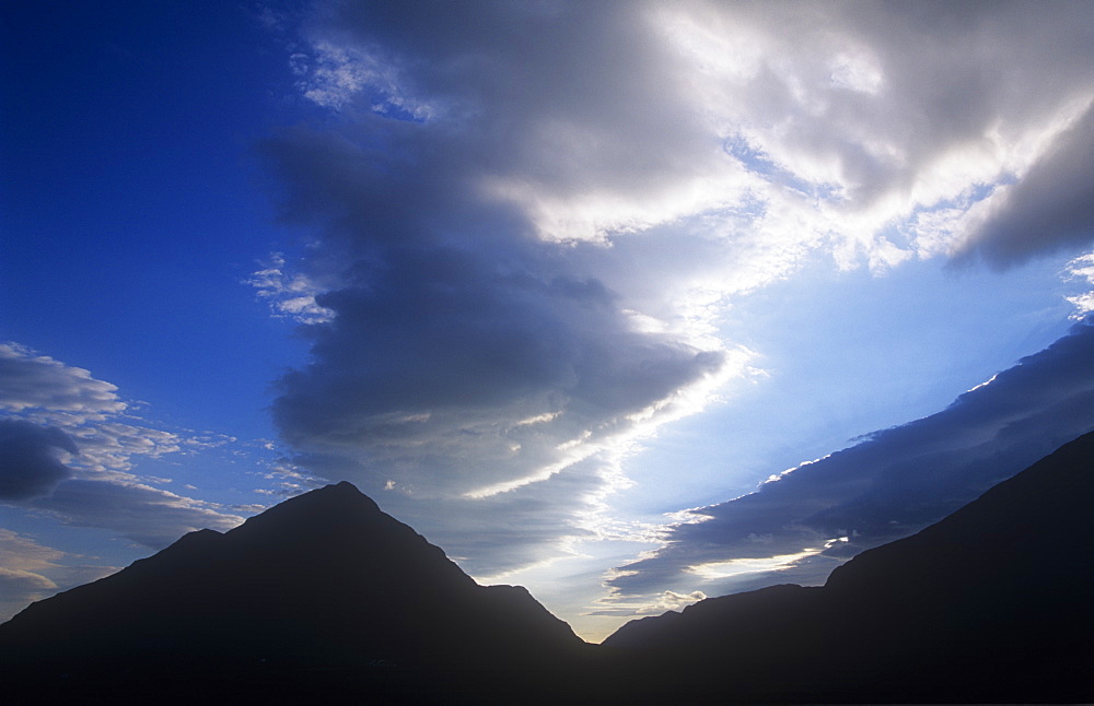 Cloud patterns at dusk over the mountains of Glen Coe, Scotland, United Kingdom, Europe