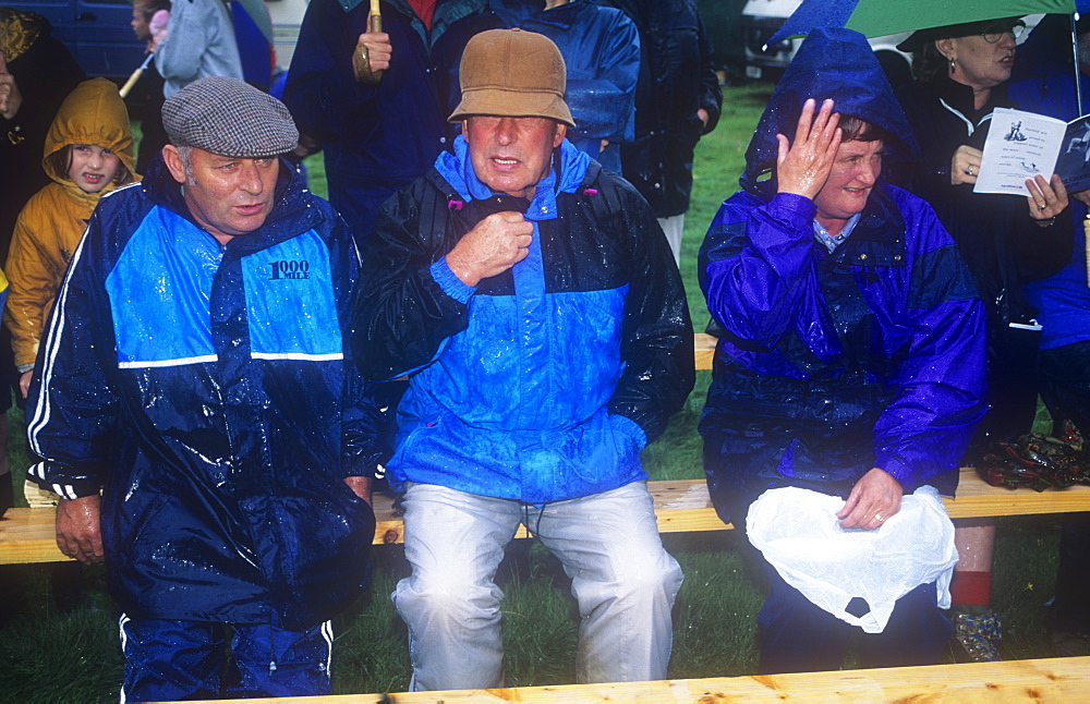 Spectators at the Ambleside Sports in the rain, Lake District, Cumbria, England, United Kingdom, Europe