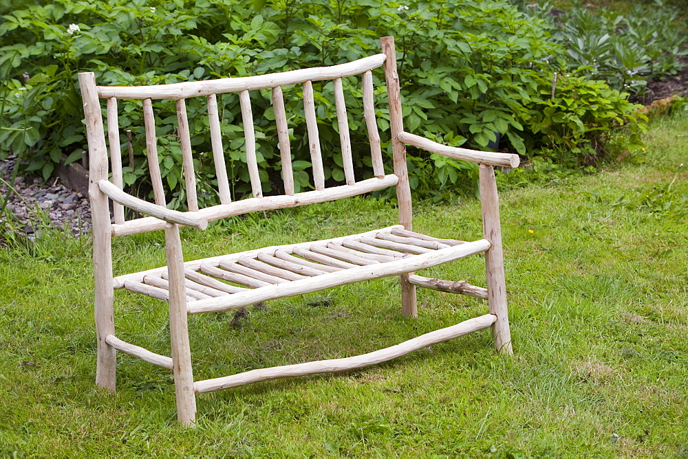 A handmade garden bench in Sprint Mill Garden, near Kendal, Cumbria England, United Kingdom, Europe