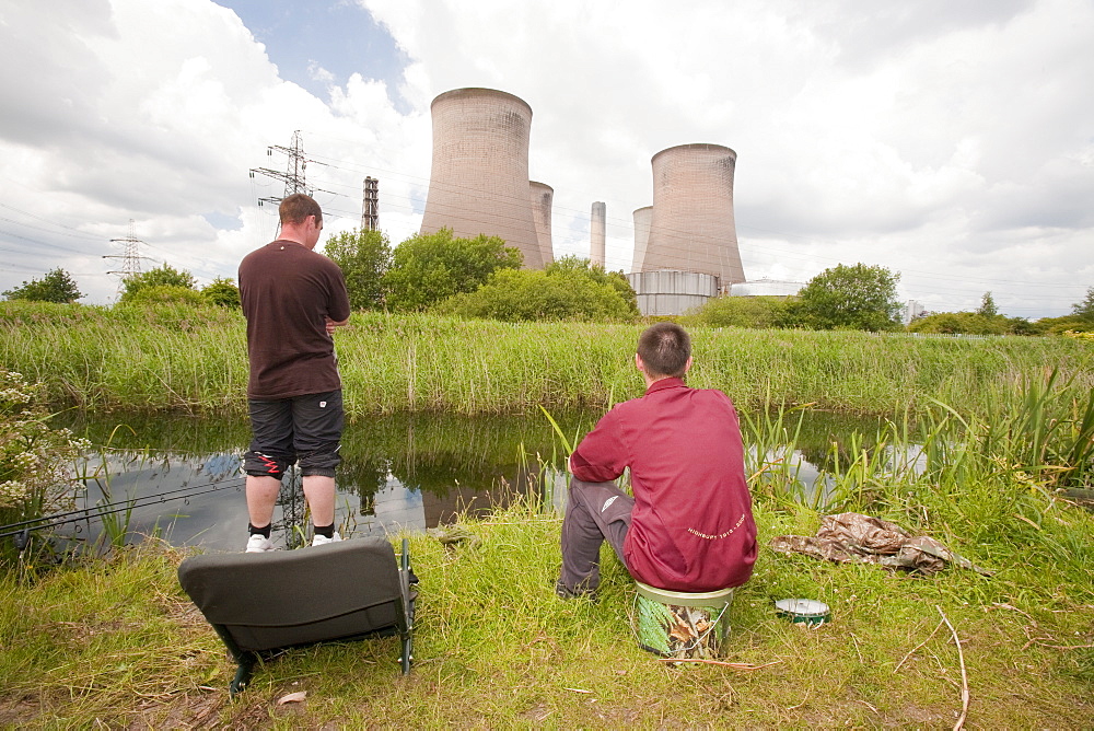 Fishermen in front of Fiddlers Ferry coal fired power station near Warrington, England, United Kingdom, Europe