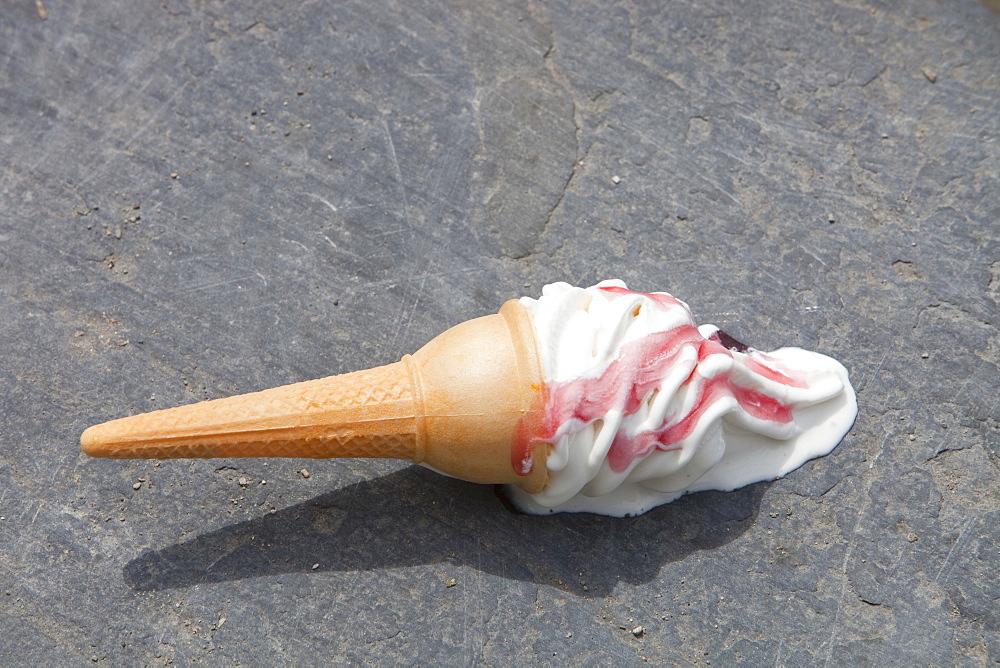 An ice cream melting on the shores of Lake Windermere, Cumbria, England, United Kingdom, Europe