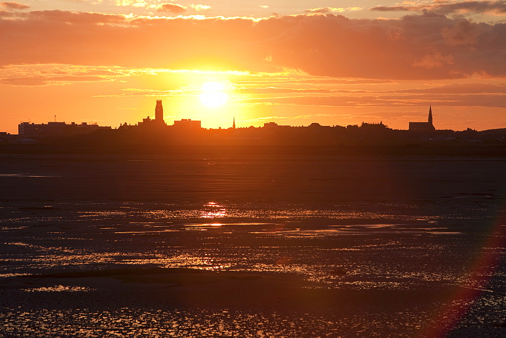 Sunset over Barrow in Furness town and shipyard, Cumbria, England, United Kingdom, Europe