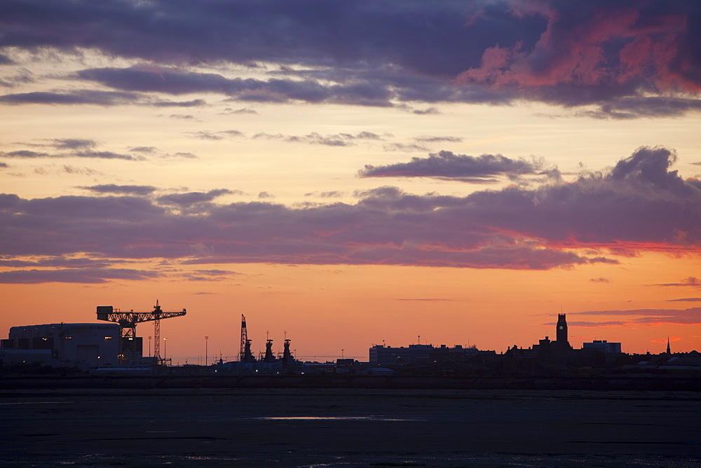 Sunset over Barrow in Furness town and shipyard, Cumbria, England, United Kingdom, Europe