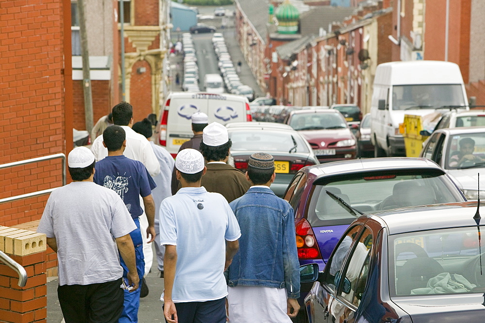 Muslims off to Friday prayers in the Asian area of Blackburn, Lancashire, England, United Kingdom, Europe