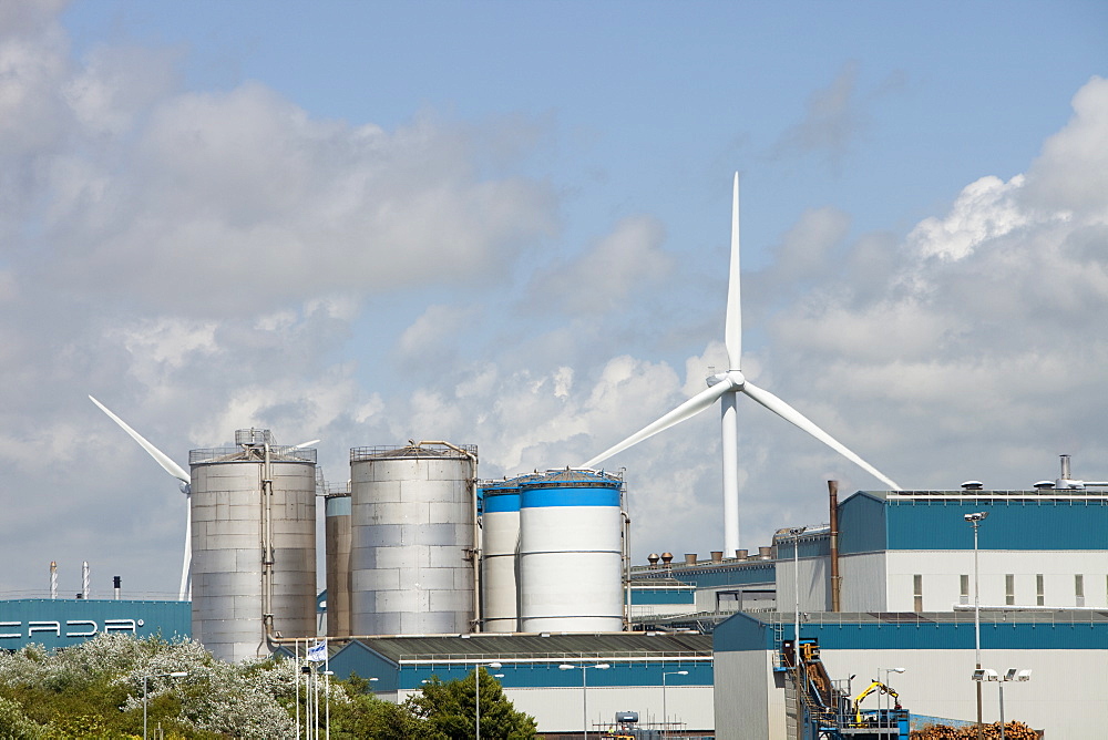 Wind turbines producing renewable electricity in the grounds of the Iggesund paperboard manufacturer on the outskirts of Workington, Cumbria, England, United Kingdom, Europe