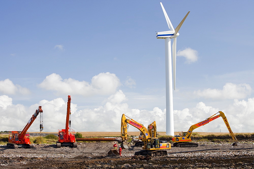 Construction workers working on the foreshore of the Solway Firth near Workington, Cumbria, England, United Kingdom, Europe