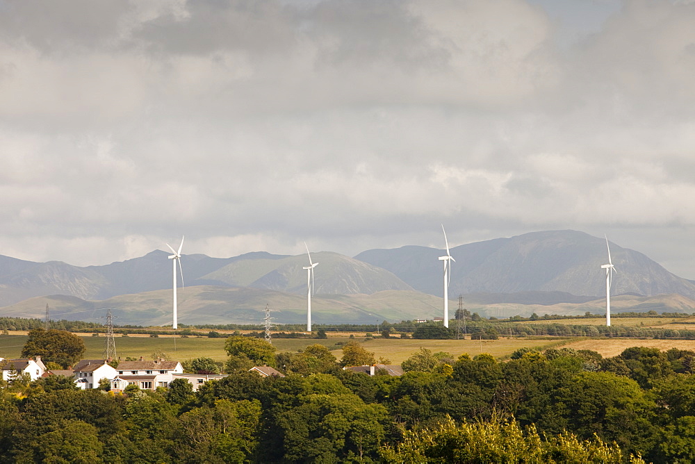 Wind turbines on the outskirts of Workington, with the Lake District hills beyond, Cumbria, England, United Kingdom, Europe