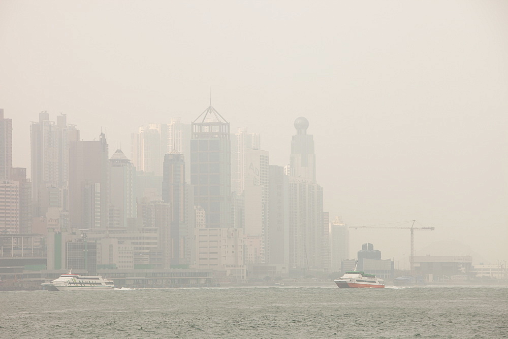 Hong Kong skyline and tower blocks in smoggy conditions, China, Asia