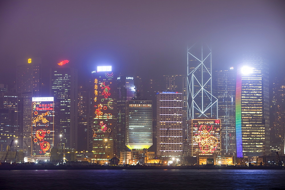 Office blocks lit up at night in Hong Kong, China, Asia