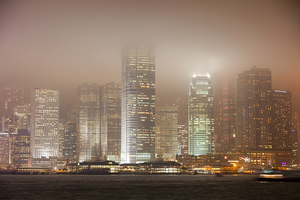 Office blocks lit up at night in Hong Kong, China, Asia