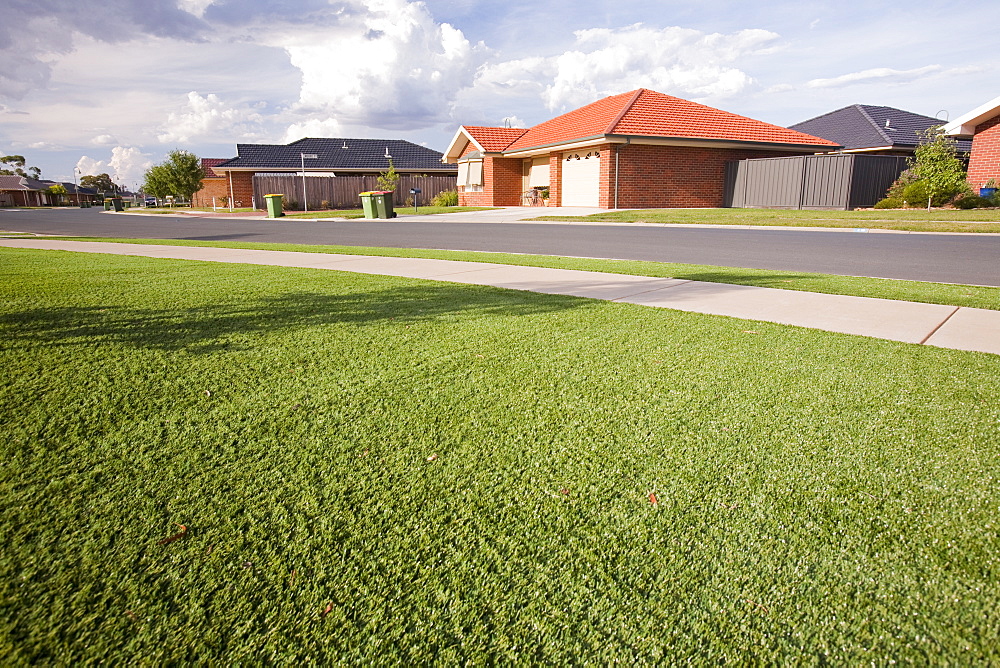 New houses designed with plastic grass lawns as it is too expensive to water lawns, or water restrictions don't allow lawn watering, Echuca, Victoria, Australia, Pacific