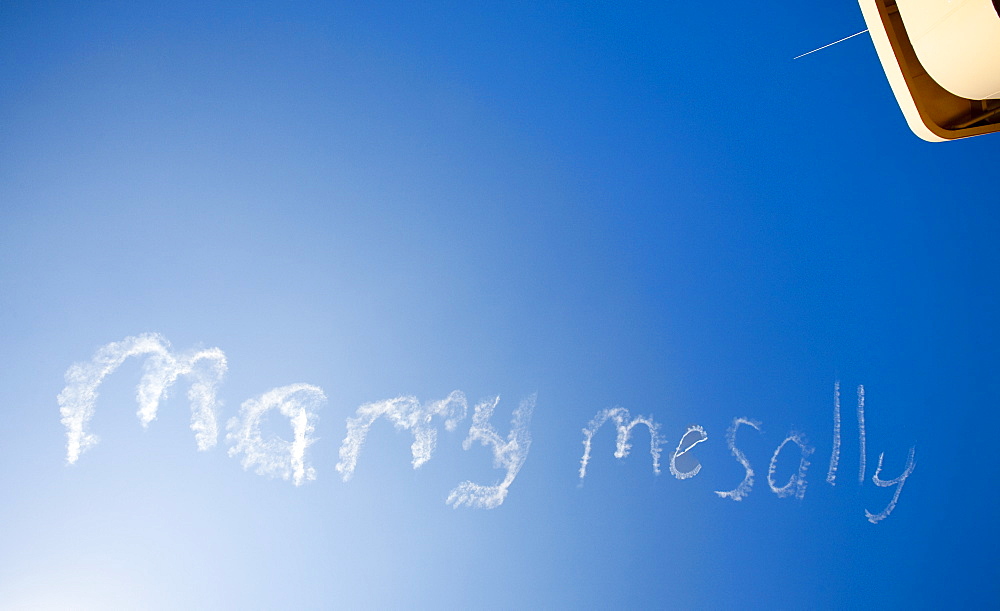 A sign written in the sky by a stunt plane reading Marry me Sally, Sydney, New South Wales, Australia, Pacific