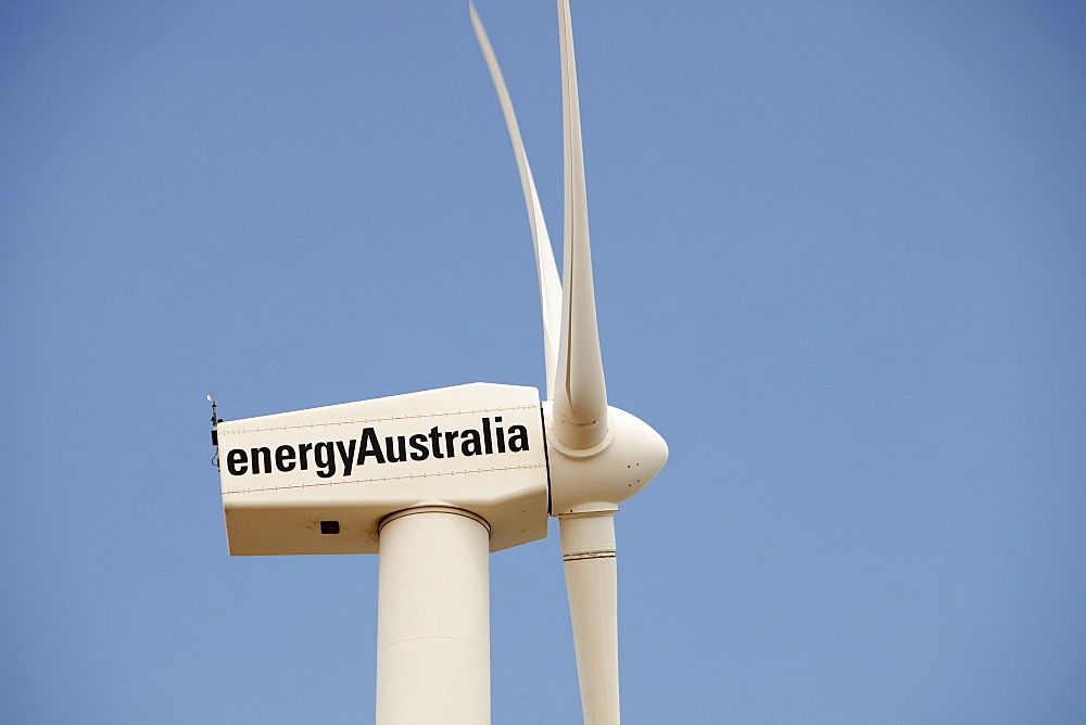 A lone wind turbine stands defiant pointing to a more sustainable future, in Newcastle, the world's largest coal port, New South Wales, Australia, Pacific